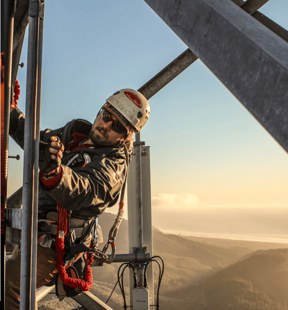 Bryan Hall of Rose City Ropes climbs a cell tower using ropes